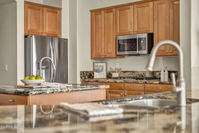 a kitchen with a stove a sink and a cabinets