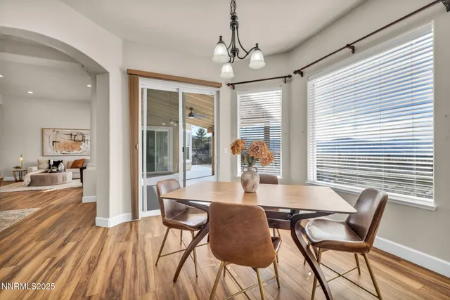 a living room with furniture a fireplace and a table