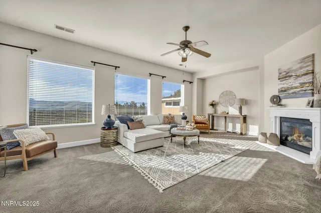 a spacious bedroom with a large bed and a fireplace