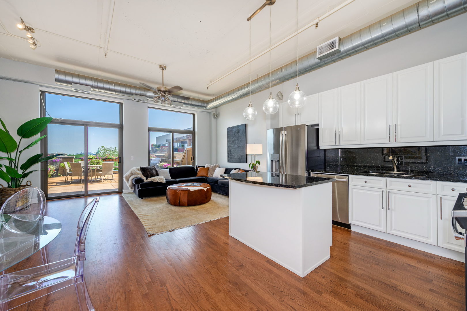 1301 West Madison Street, Unit 520 Chicago, IL 60607 - Photo 3 of 17 a kitchen with sink refrigerator and cabinets