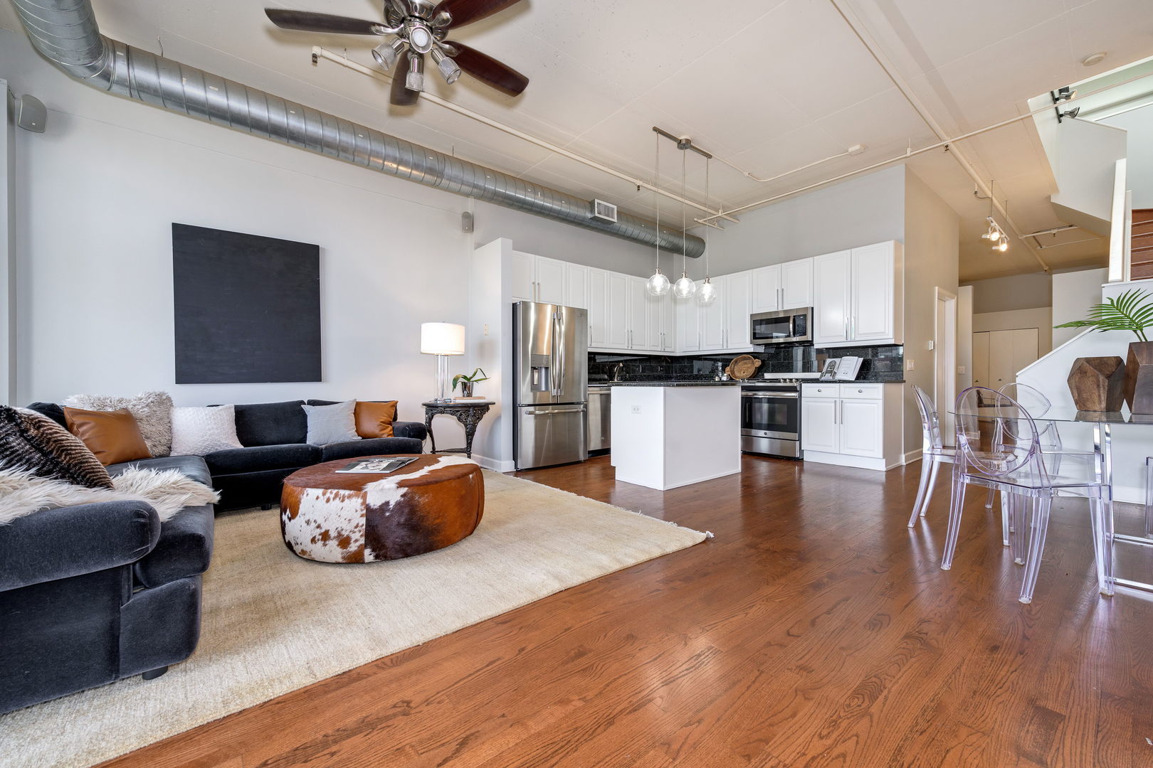 1301 West Madison Street, Unit 520 Chicago, IL 60607 - Photo 6 of 17 a living room with furniture and kitchen view