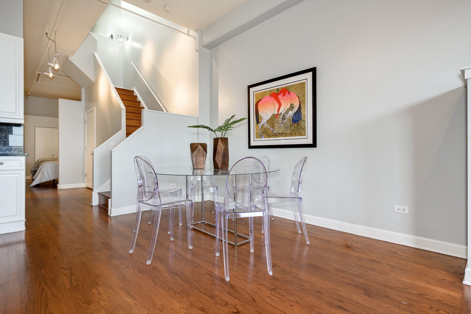 1301 West Madison Street, Unit 520 Chicago, IL 60607 - Photo 8 of 17 a view of a dining room with furniture and wooden floor