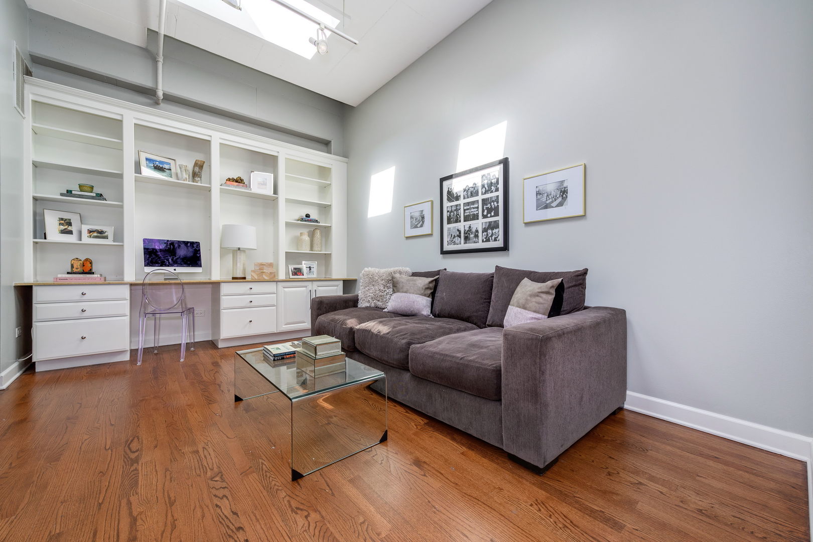 1301 West Madison Street, Unit 520 Chicago, IL 60607 - Photo 9 of 17 a living room with furniture and wooden floor