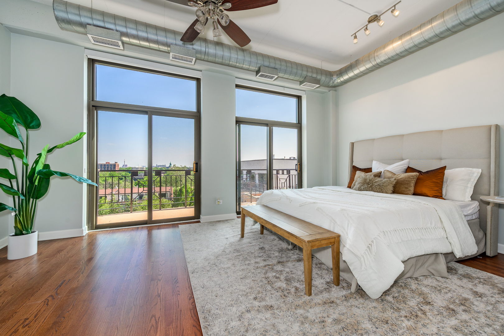 1301 West Madison Street, Unit 520 Chicago, IL 60607 - Photo 10 of 17 a bed sitting in a spacious bedroom next to a window