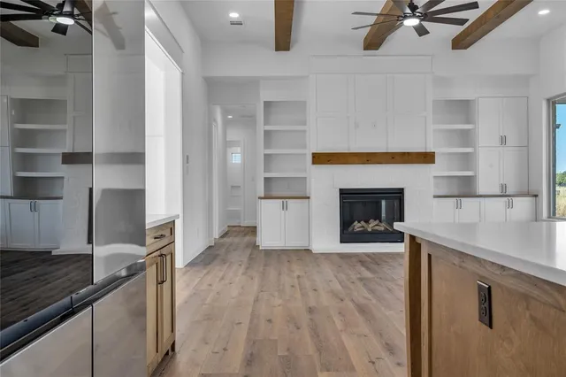 a view of a kitchen with furniture and a fireplace