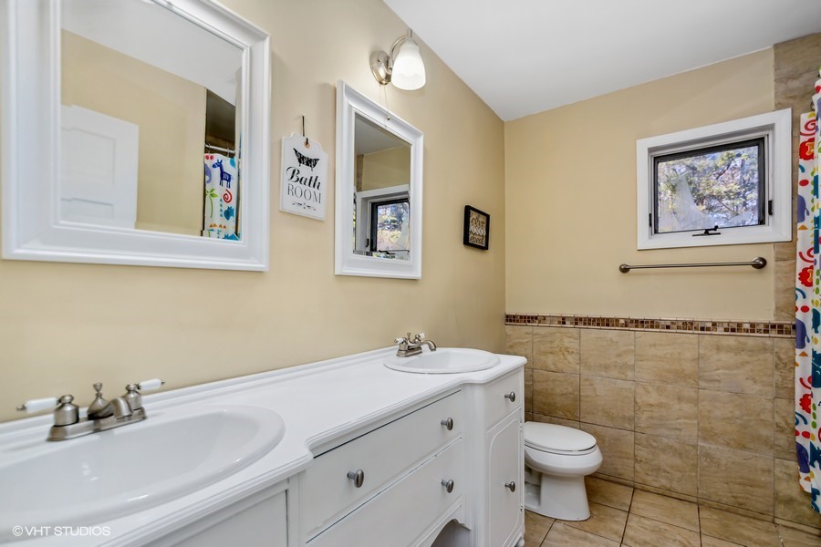 3654 North 12000 W Road Bonfield, IL 60913 - Photo 15 of 19 a bathroom with a sink mirror vanity and toilet