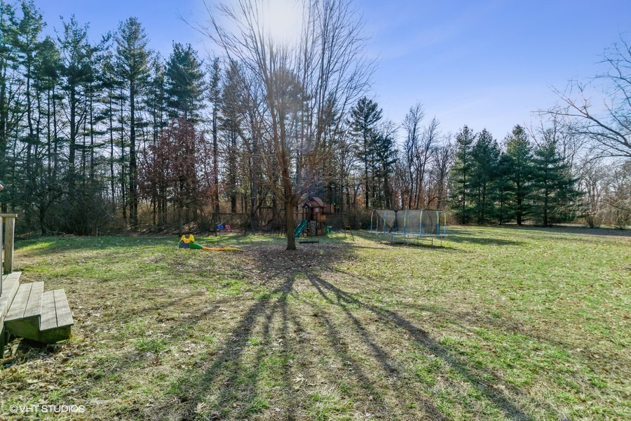 3654 North 12000 W Road Bonfield, IL 60913 - Photo 4 of 19 a backyard of a house with lots of green space
