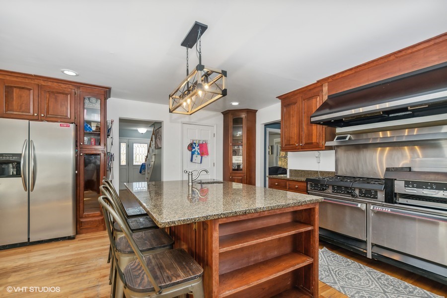 3654 North 12000 W Road Bonfield, IL 60913 - Photo 5 of 19 a kitchen with stainless steel appliances granite countertop a sink a stove and refrigerator