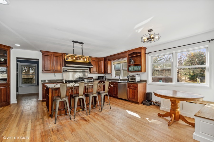 3654 North 12000 W Road Bonfield, IL 60913 - Photo 6 of 19 a view of a dining room with furniture window and wooden floor