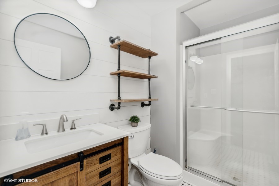 3654 North 12000 W Road Bonfield, IL 60913 - Photo 8 of 19 a bathroom with a sink a toilet and a mirror