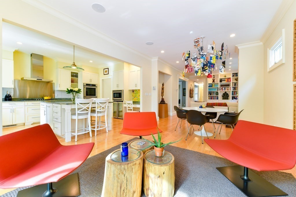 265 Upland Road Cambridge, MA 02140 - Photo 11 of 39 a view of a dining room with furniture and wooden floor