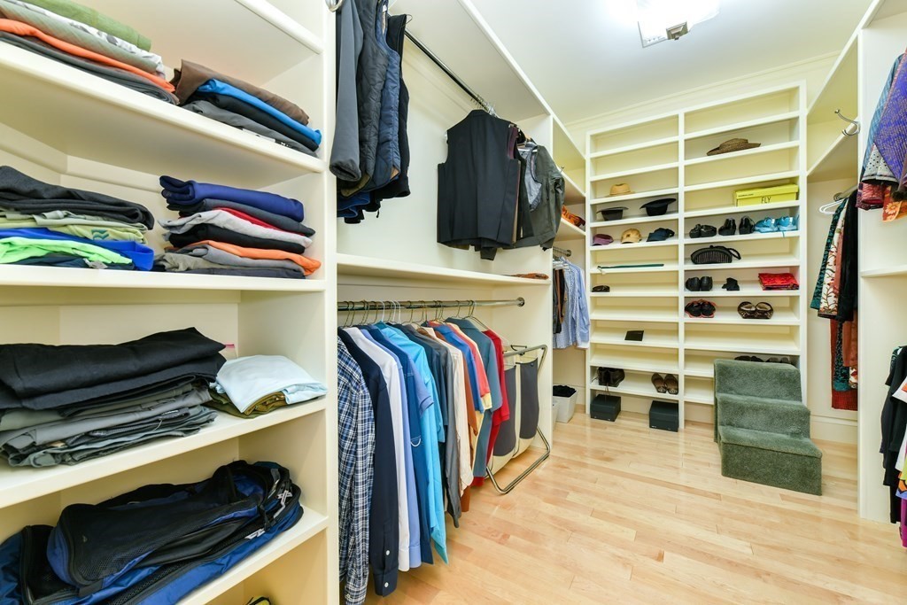 265 Upland Road Cambridge, MA 02140 - Photo 21 of 39 a view of walk in closet with clothes and shoes