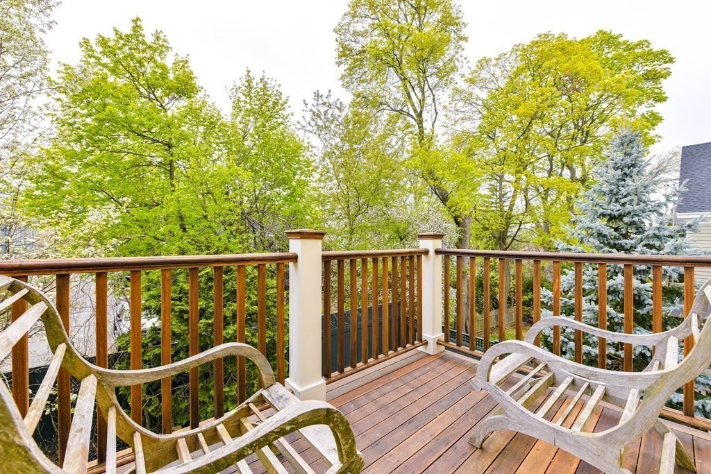 265 Upland Road Cambridge, MA 02140 - Photo 22 of 39 a view of a balcony with wooden chairs