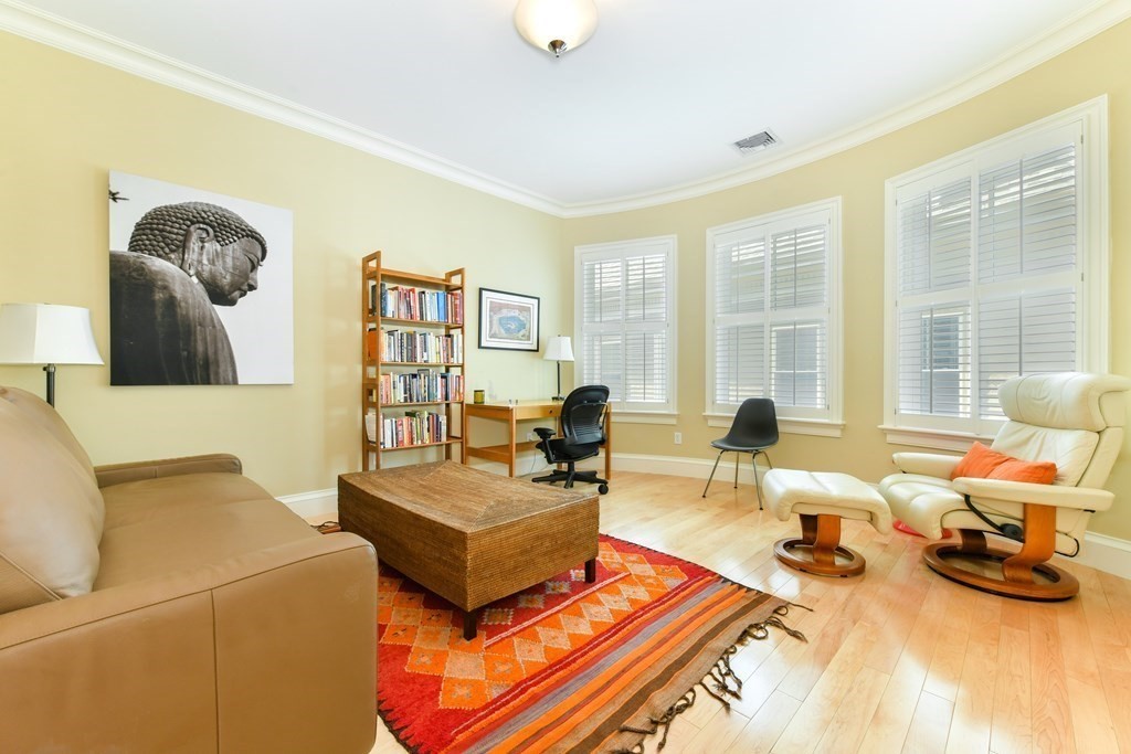 265 Upland Road Cambridge, MA 02140 - Photo 24 of 39 a living room with furniture and a table