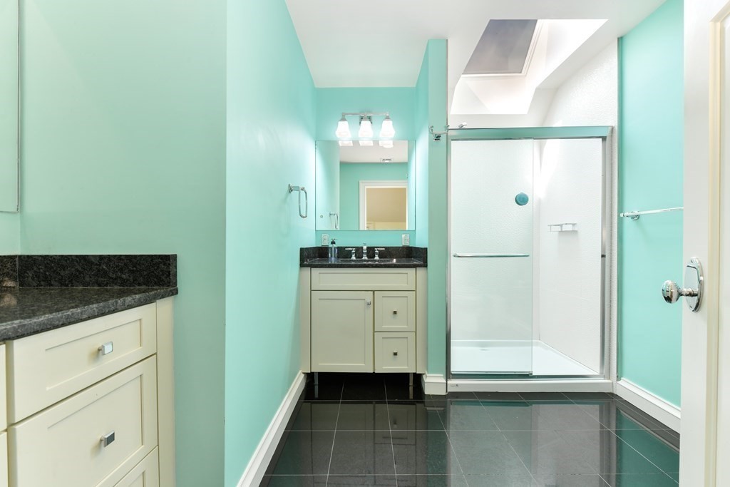 265 Upland Road Cambridge, MA 02140 - Photo 31 of 39 a bathroom with a shower and a sink