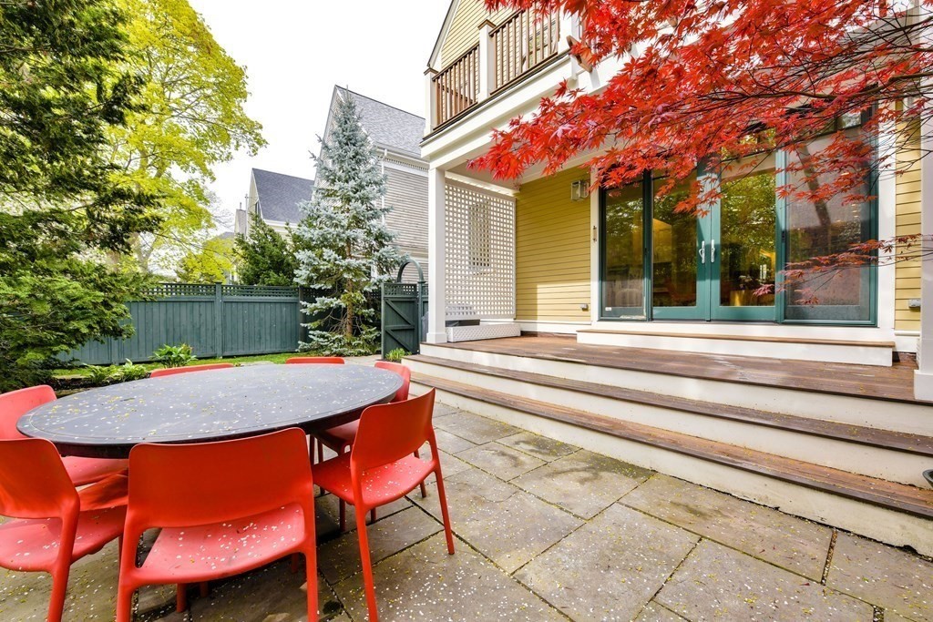 265 Upland Road Cambridge, MA 02140 - Photo 36 of 39 a backyard of a house with yard and outdoor seating