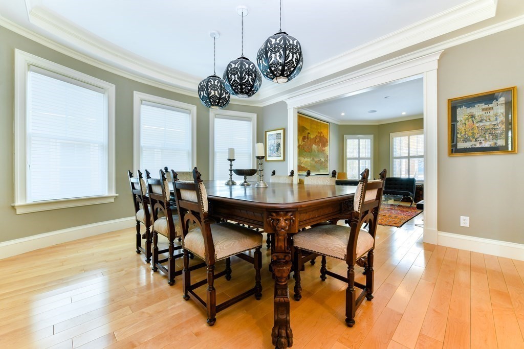 265 Upland Road Cambridge, MA 02140 - Photo 6 of 39 a view of a dining room with furniture and wooden floor