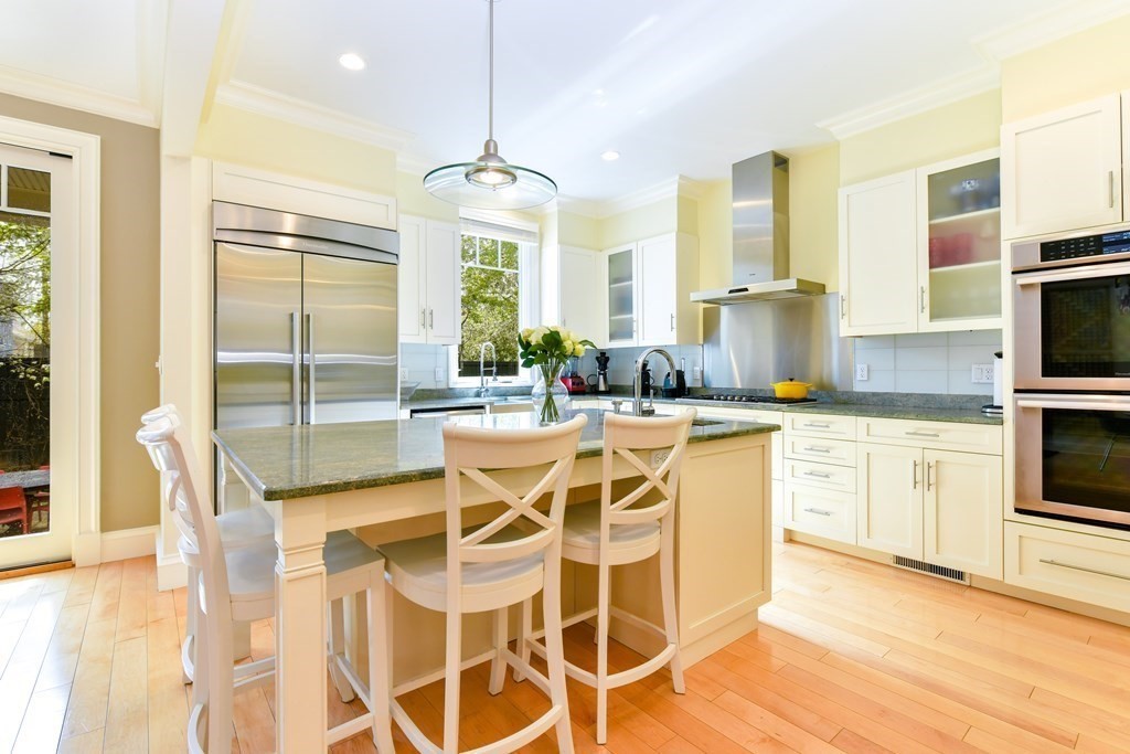 265 Upland Road Cambridge, MA 02140 - Photo 7 of 39 a dining hall with stainless steel appliances granite countertop a stove and a refrigerator