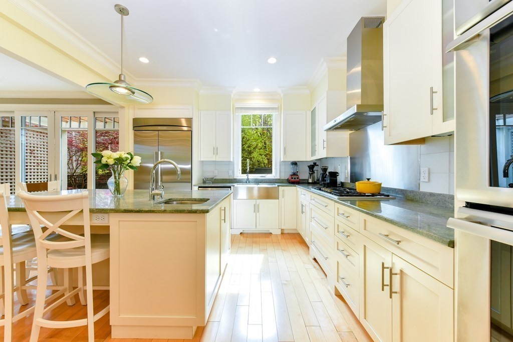 265 Upland Road Cambridge, MA 02140 - Photo 8 of 39 a large kitchen with granite countertop a large counter top appliances and cabinets
