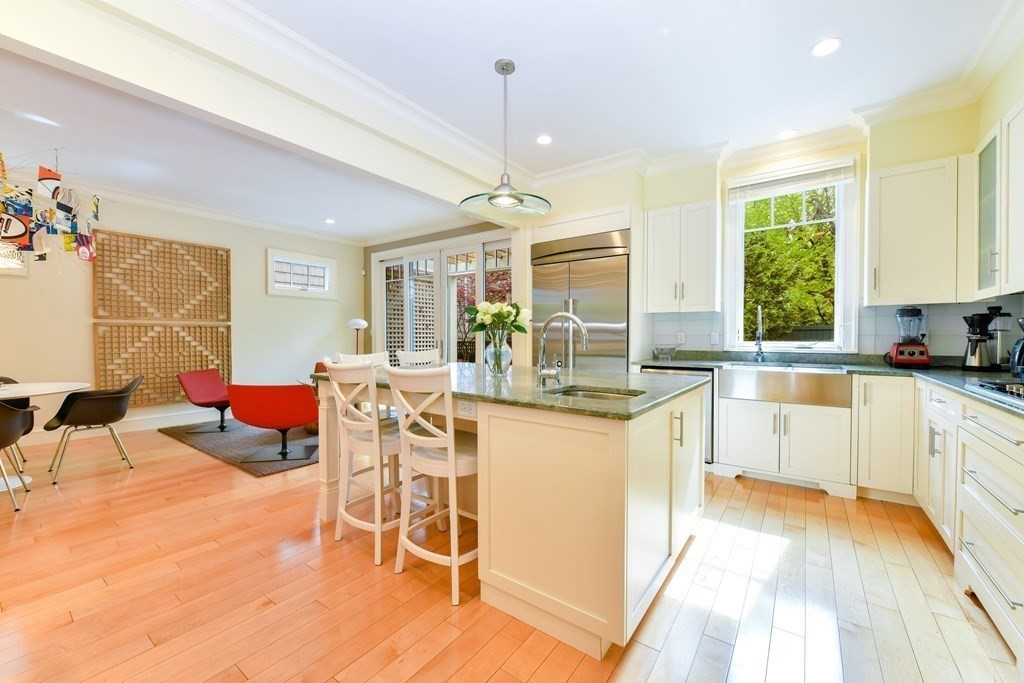 265 Upland Road Cambridge, MA 02140 - Photo 10 of 39 a large kitchen with a table and chairs in it