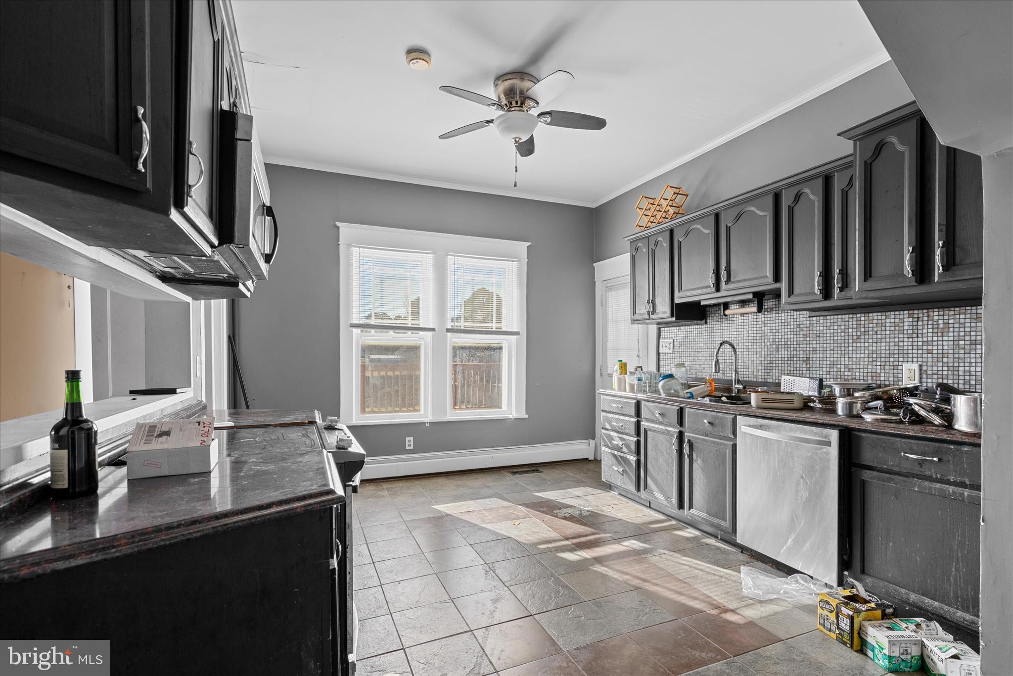26740 Old State Road Crisfield, MD 21817 - Photo 17 of 49 a kitchen with stainless steel appliances granite countertop a sink stove and refrigerator