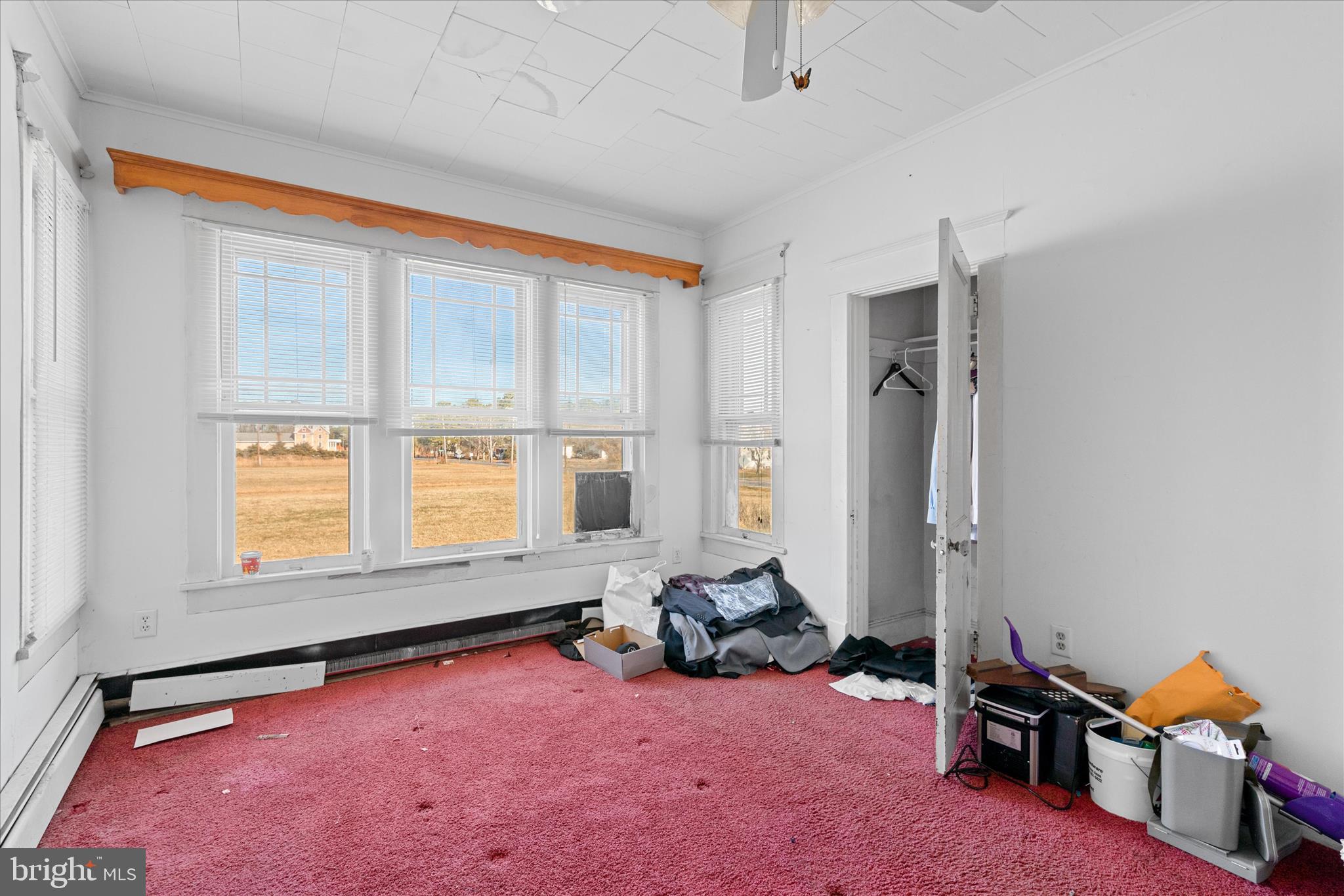 26740 Old State Road Crisfield, MD 21817 - Photo 20 of 49 a room with furniture and a window