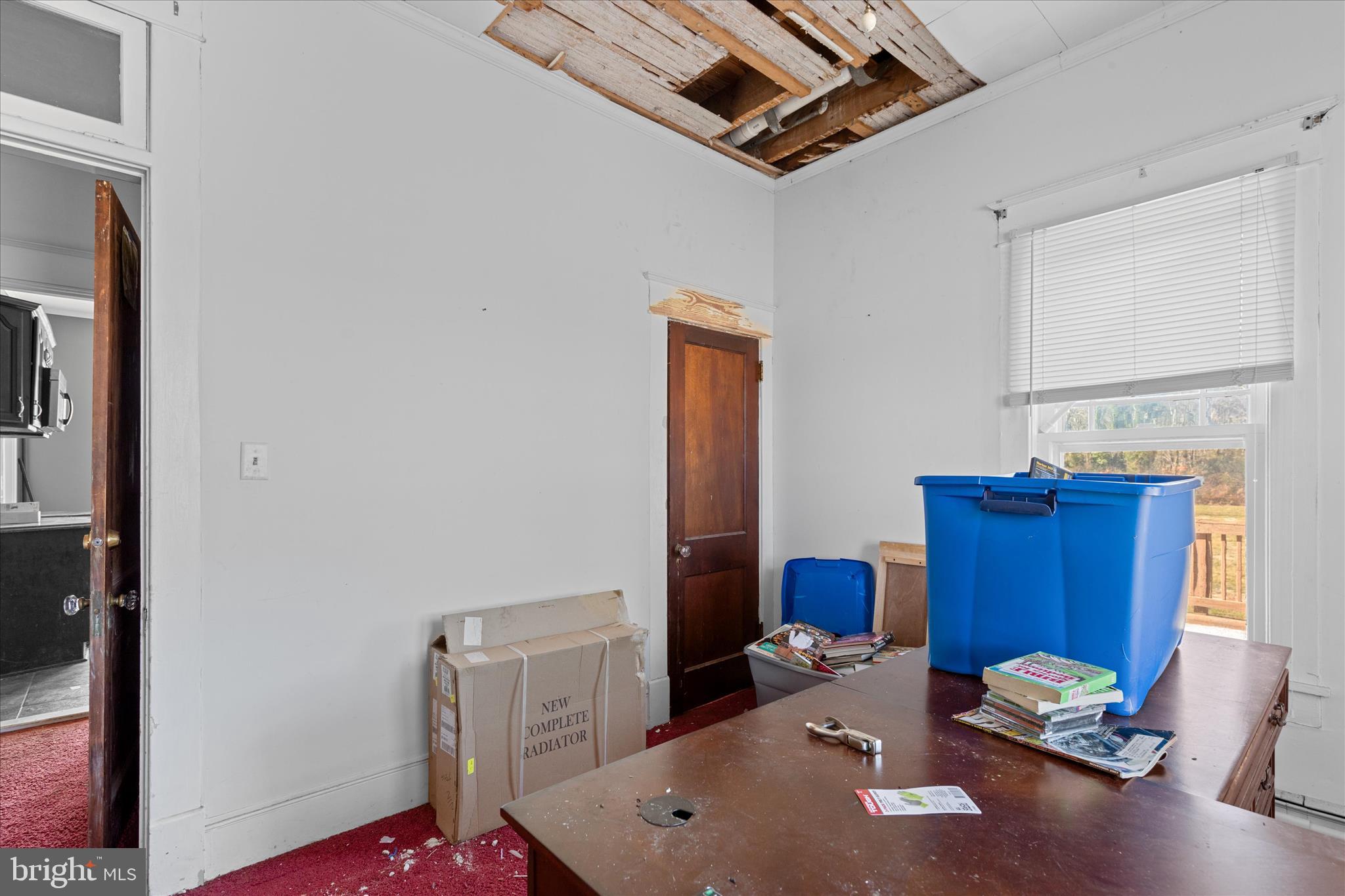 26740 Old State Road Crisfield, MD 21817 - Photo 27 of 49 a living room with furniture and a dresser