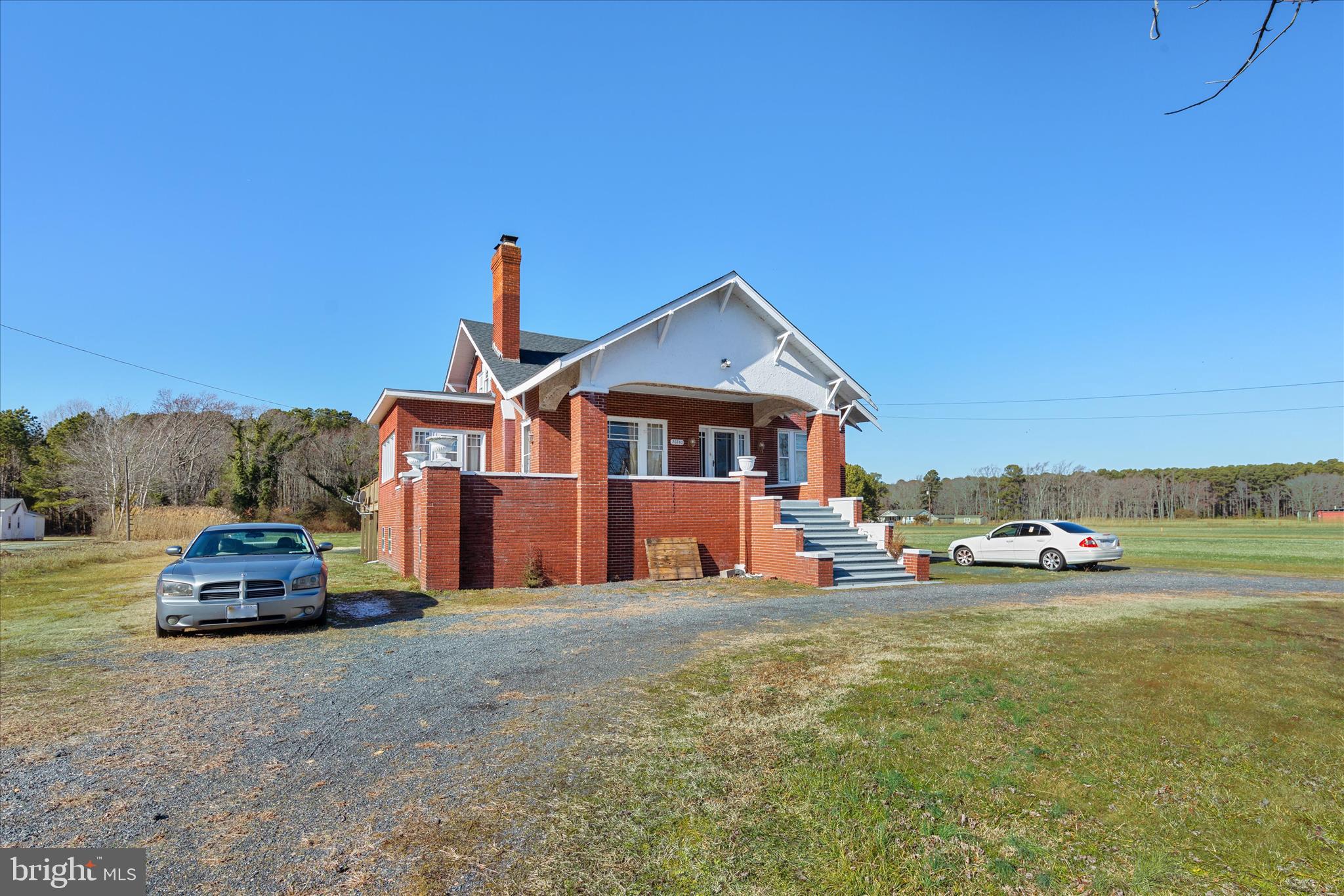26740 Old State Road Crisfield, MD 21817 - Photo 3 of 49 a front view of a house with a yard