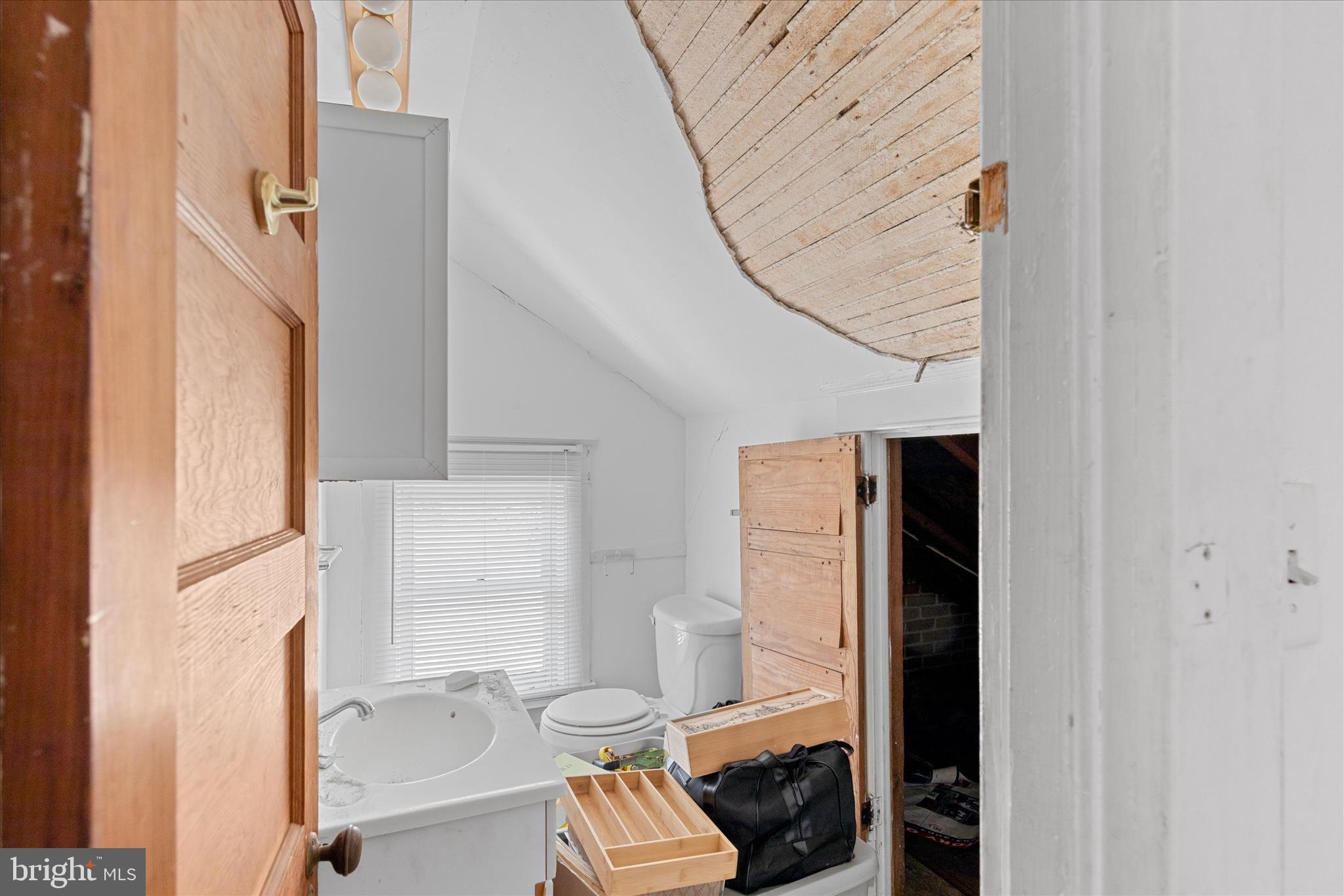 26740 Old State Road Crisfield, MD 21817 - Photo 34 of 49 a bathroom with a toilet and a shower curtain