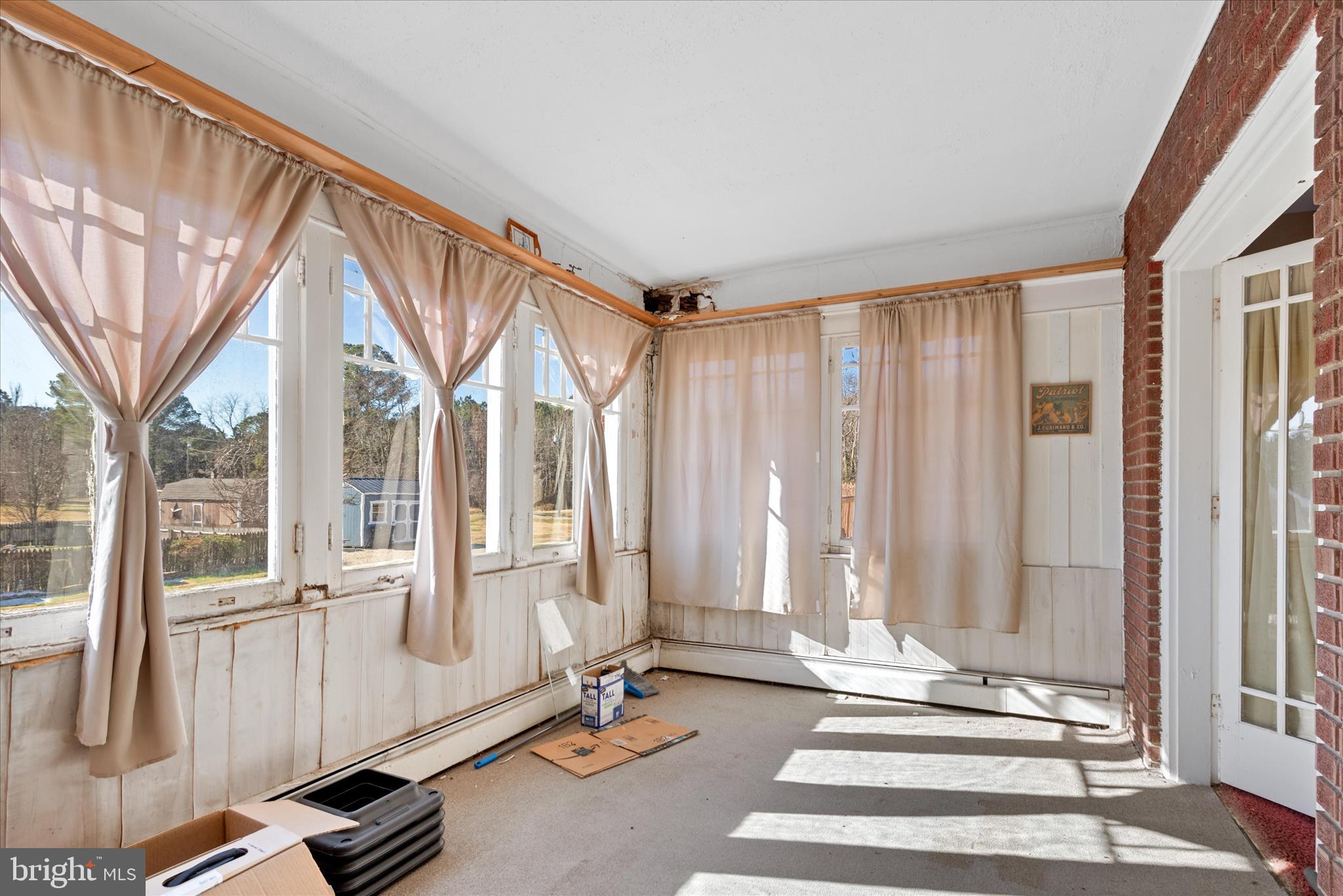 26740 Old State Road Crisfield, MD 21817 - Photo 36 of 49 a view of a room with gym equipment and floor to ceiling windows