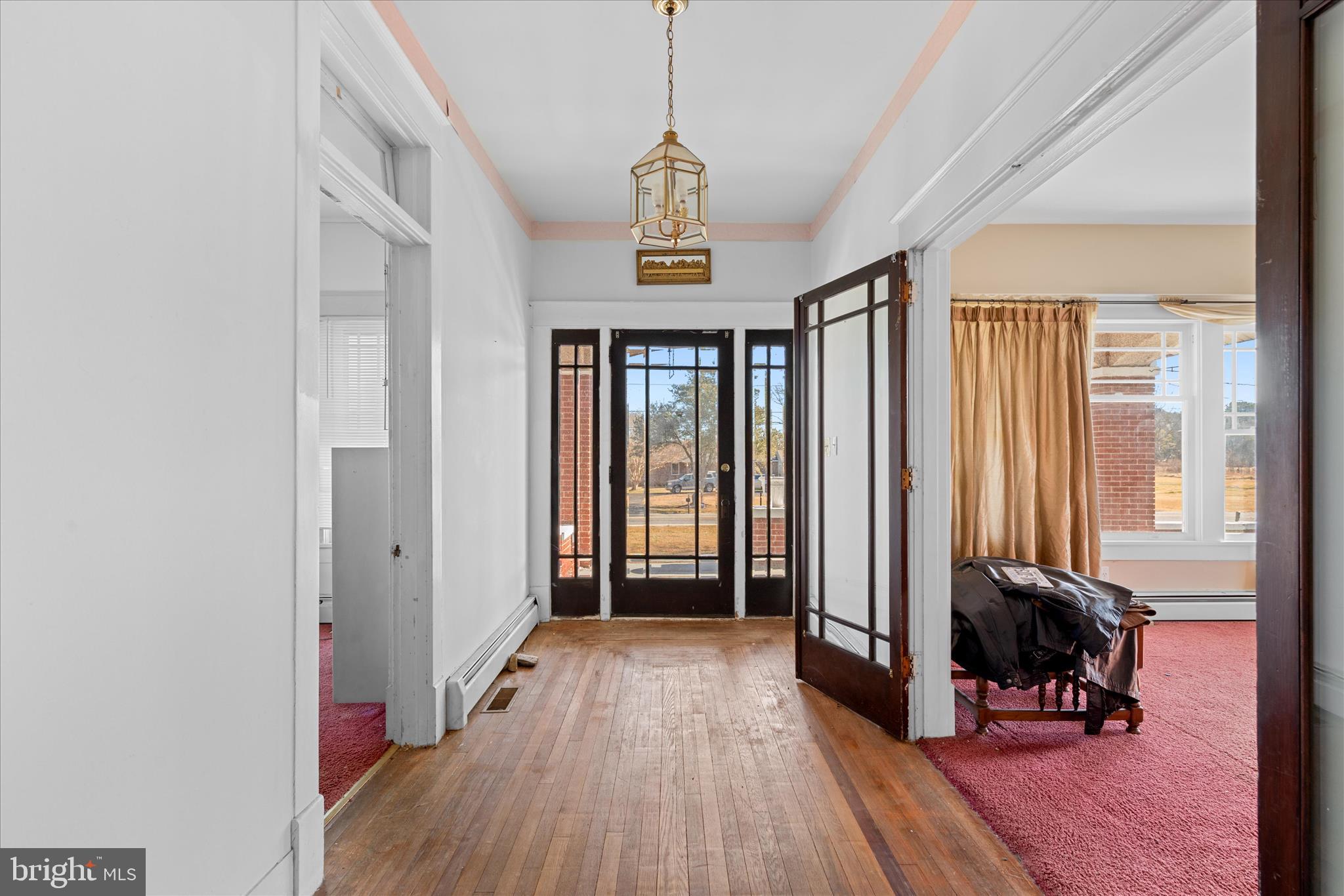 26740 Old State Road Crisfield, MD 21817 - Photo 4 of 49 a view of a livingroom with wooden floor and furniture