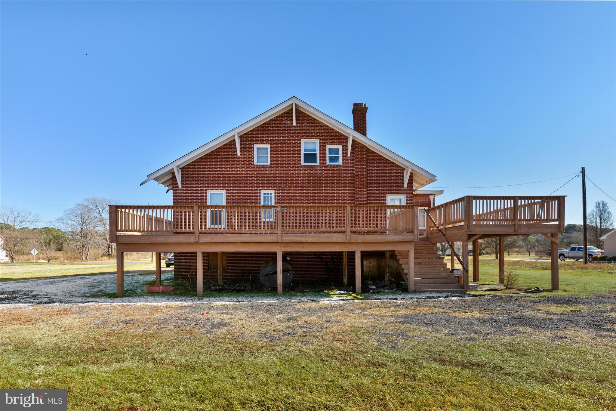 26740 Old State Road Crisfield, MD 21817 - Photo 42 of 49 a front view of a house with a yard and balcony