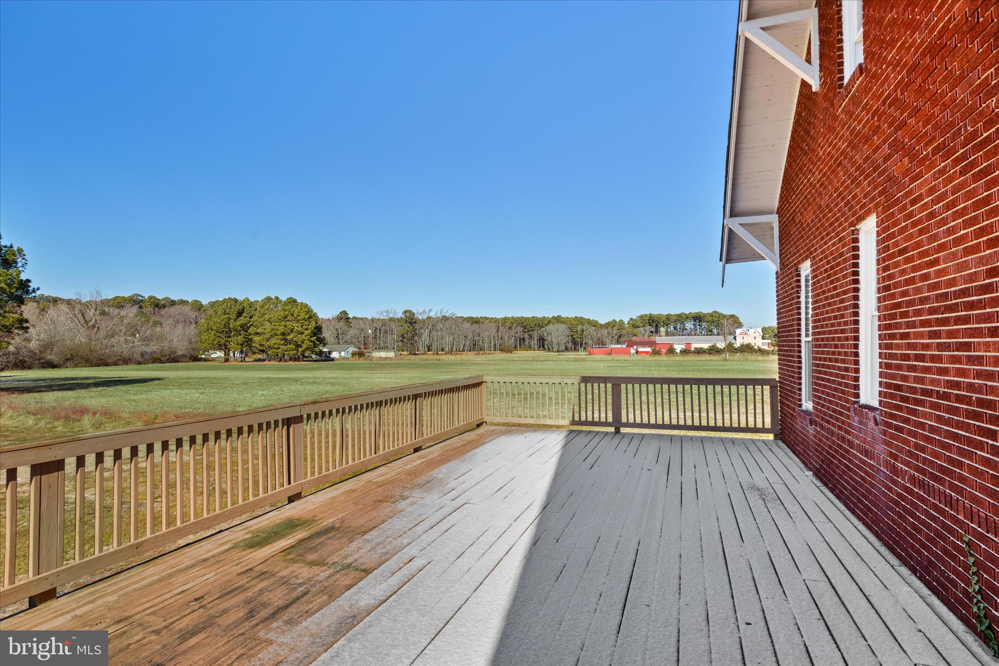 26740 Old State Road Crisfield, MD 21817 - Photo 44 of 49 a view of balcony with wooden floor and outdoor seating