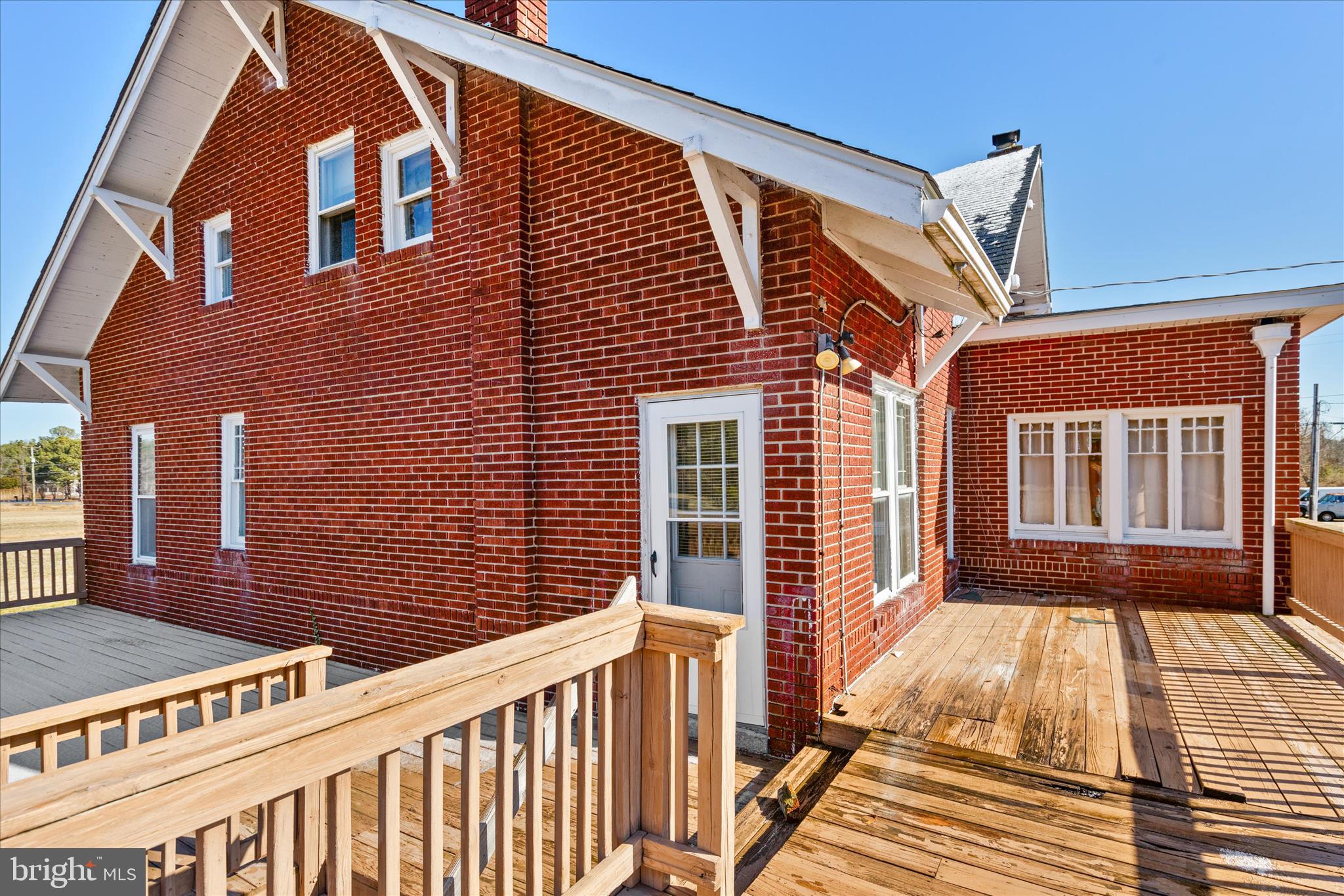 26740 Old State Road Crisfield, MD 21817 - Photo 45 of 49 a view of a brick house with a large window