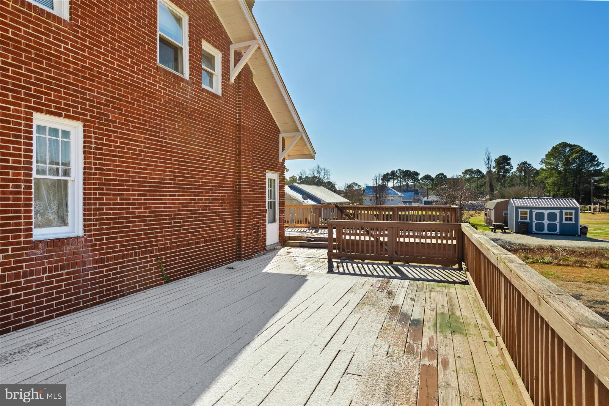 26740 Old State Road Crisfield, MD 21817 - Photo 47 of 49 a balcony with wooden floor and furniture