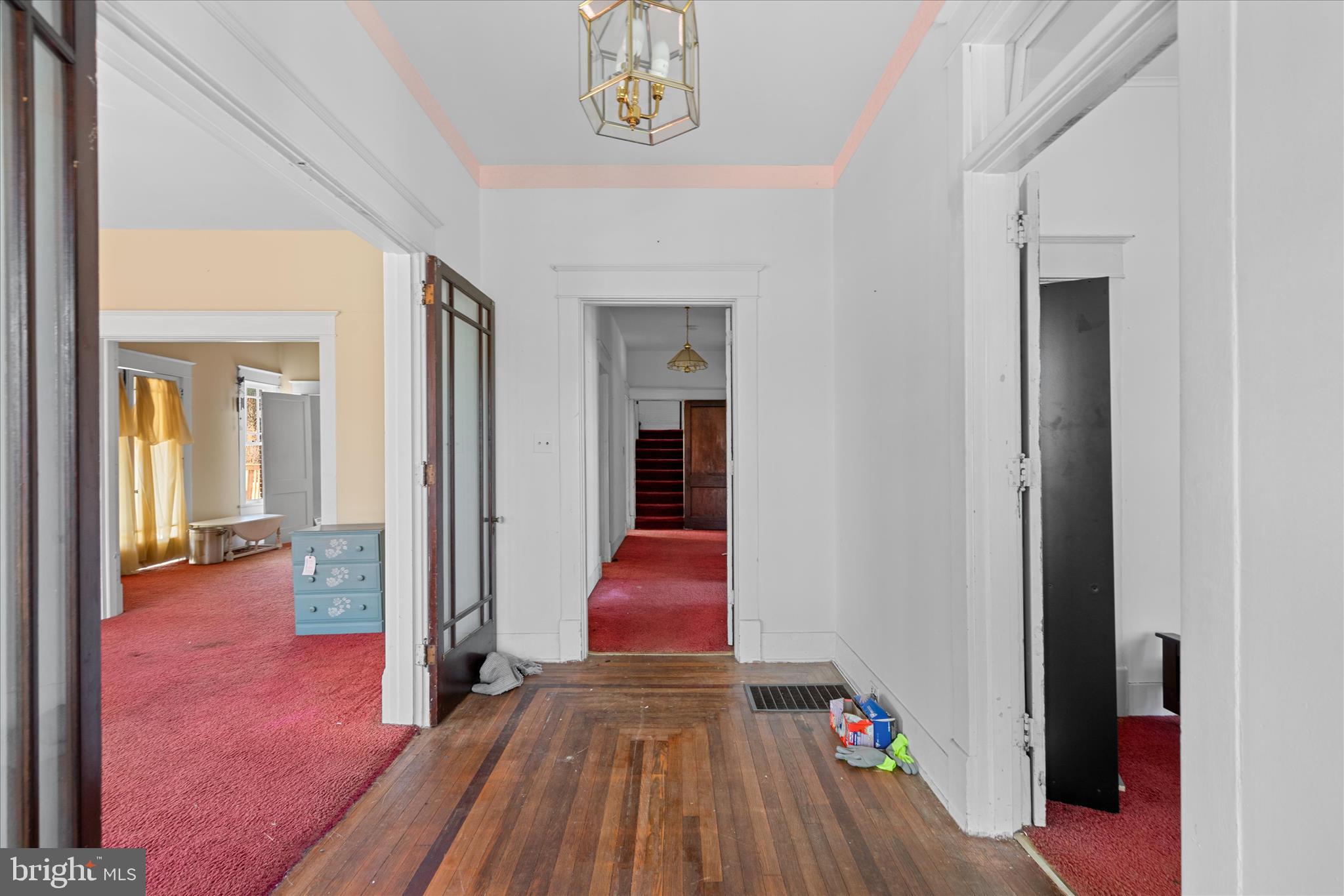 26740 Old State Road Crisfield, MD 21817 - Photo 5 of 49 a view of hallway with livingroom and hardwood floor