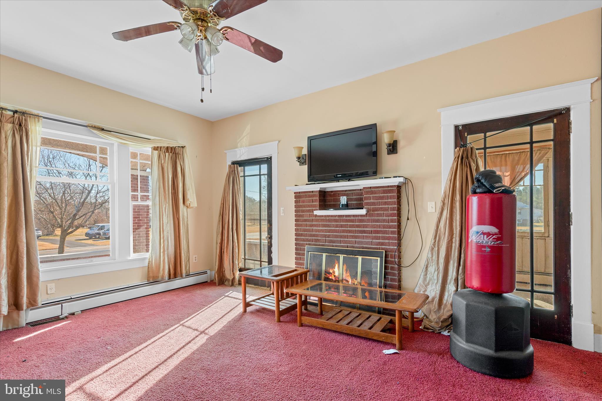 26740 Old State Road Crisfield, MD 21817 - Photo 7 of 49 a bedroom with a bed and a flat screen tv