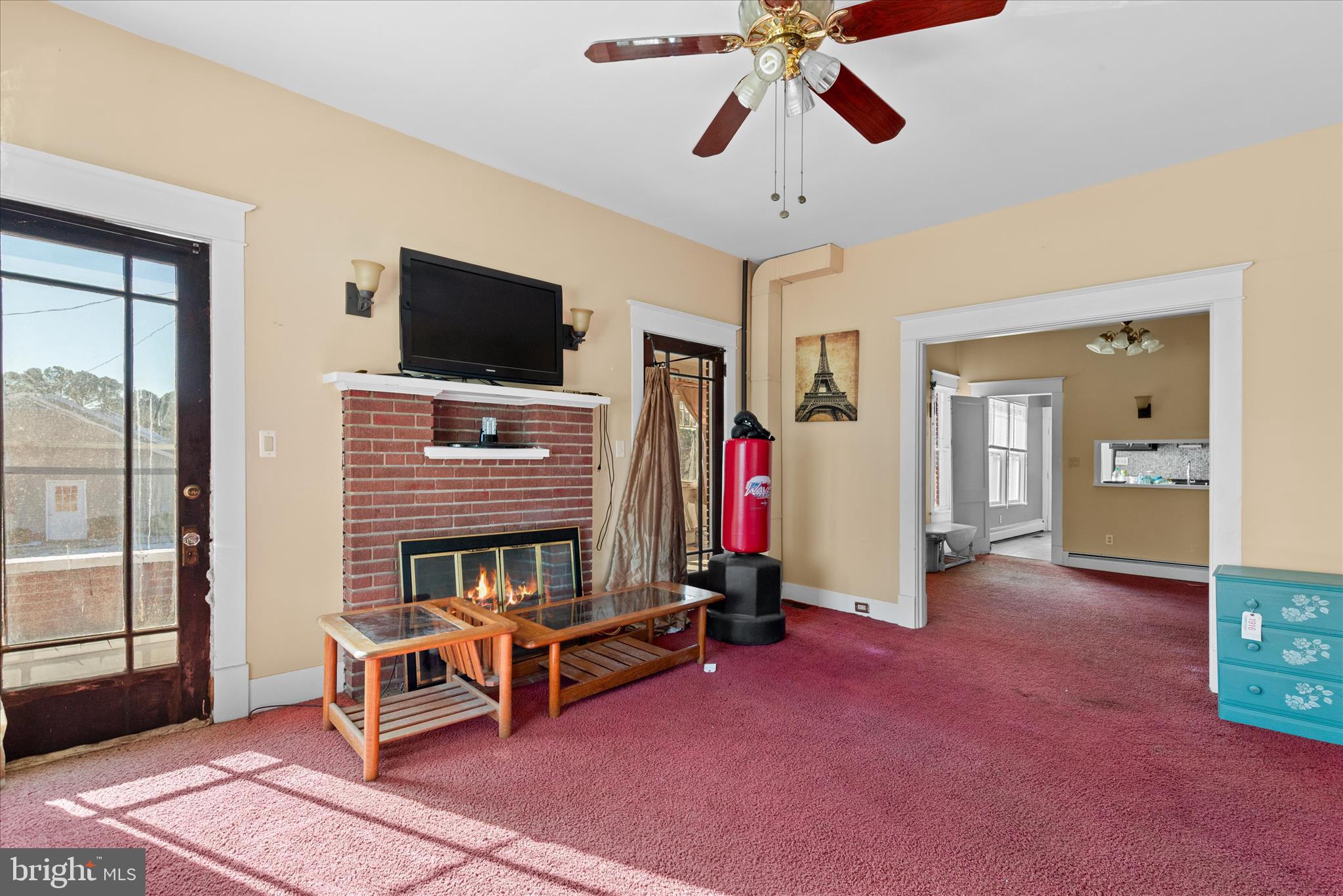 26740 Old State Road Crisfield, MD 21817 - Photo 10 of 49 a living room with furniture and a flat screen tv