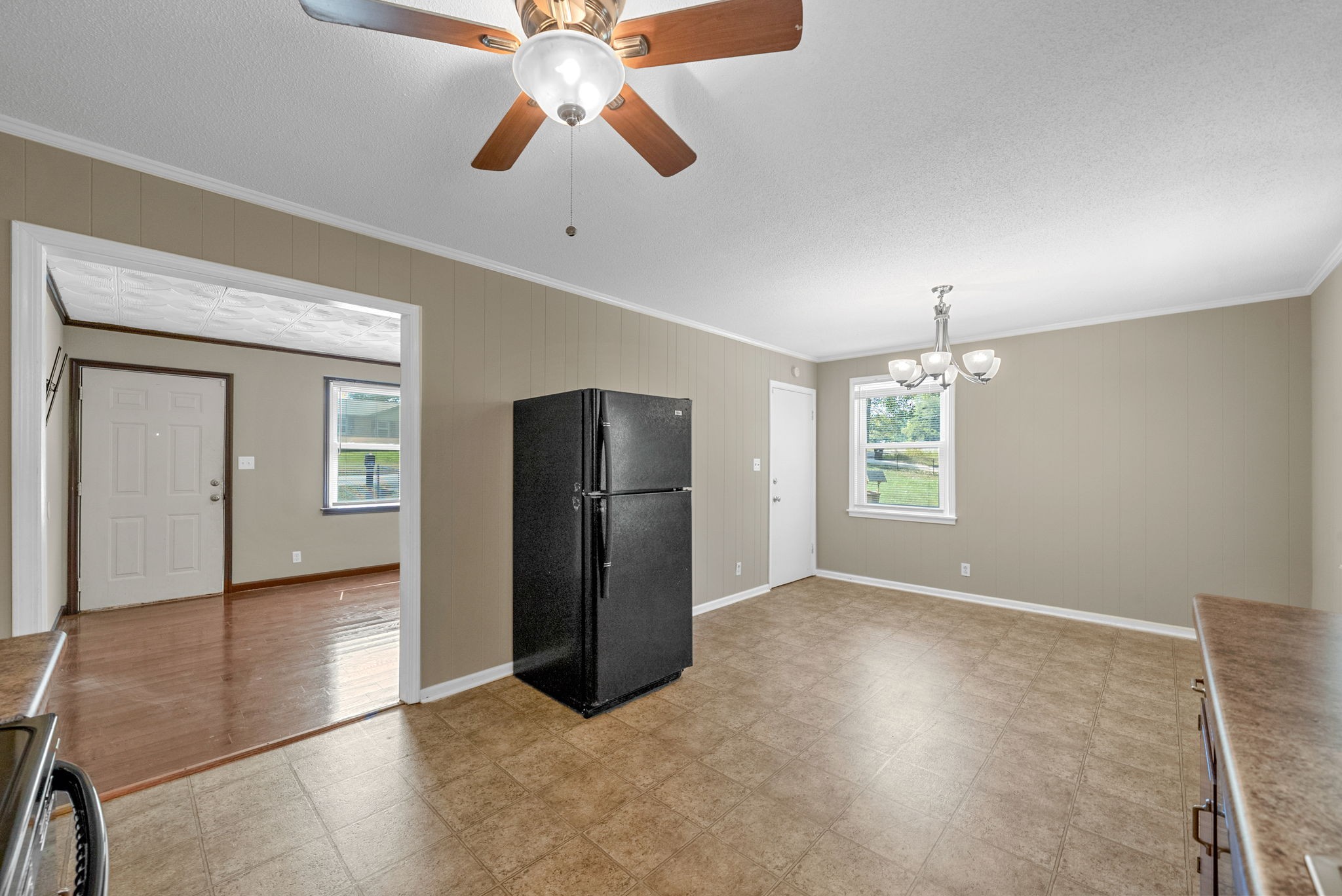 809 Pollard Road Clarksville, TN 37042 - Photo 12 of 28 an empty room with chandelier fan and windows