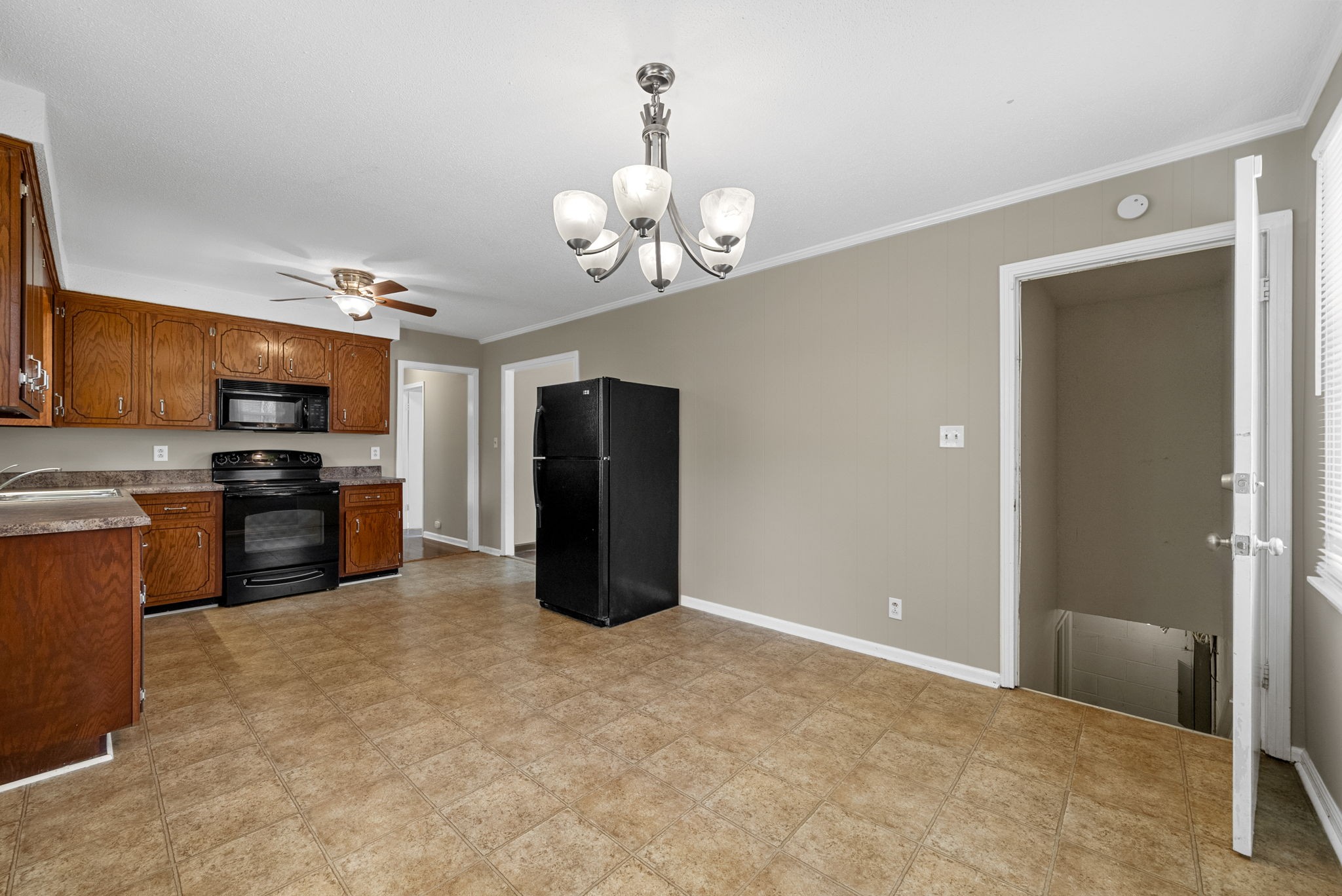 809 Pollard Road Clarksville, TN 37042 - Photo 13 of 28 a kitchen with stainless steel appliances granite countertop a refrigerator and a stove top oven
