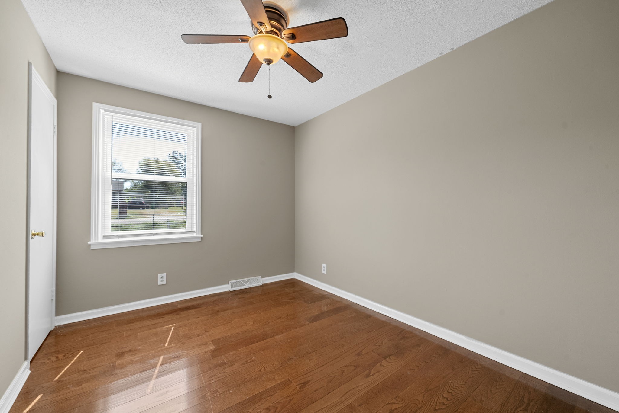 809 Pollard Road Clarksville, TN 37042 - Photo 17 of 28 an empty room with a window and a fan