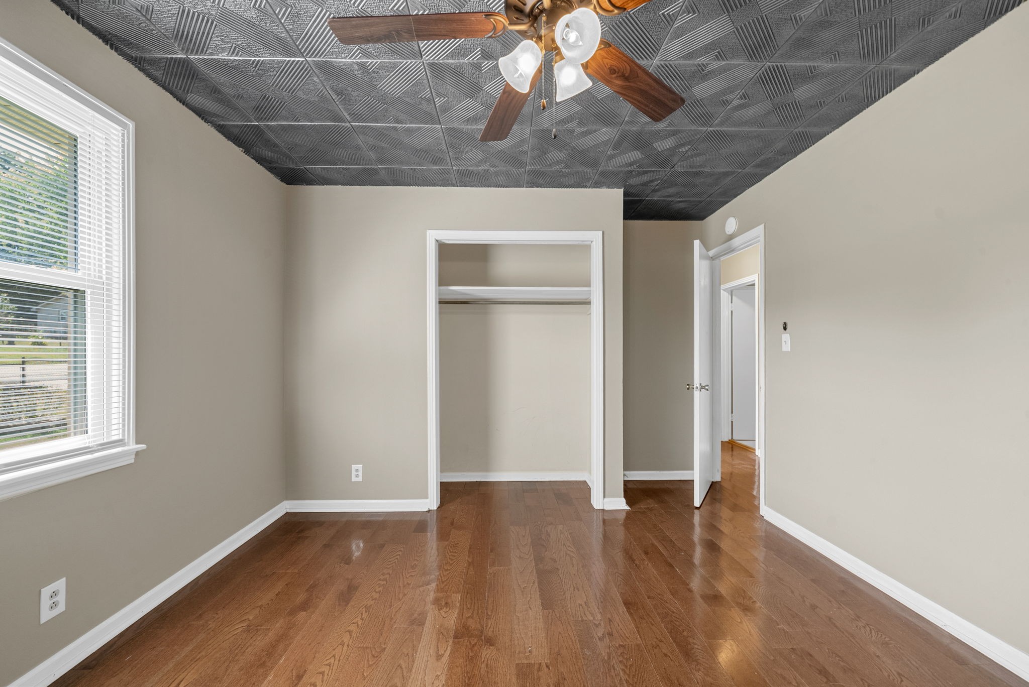 809 Pollard Road Clarksville, TN 37042 - Photo 20 of 28 a view of an empty room with wooden floor and a window