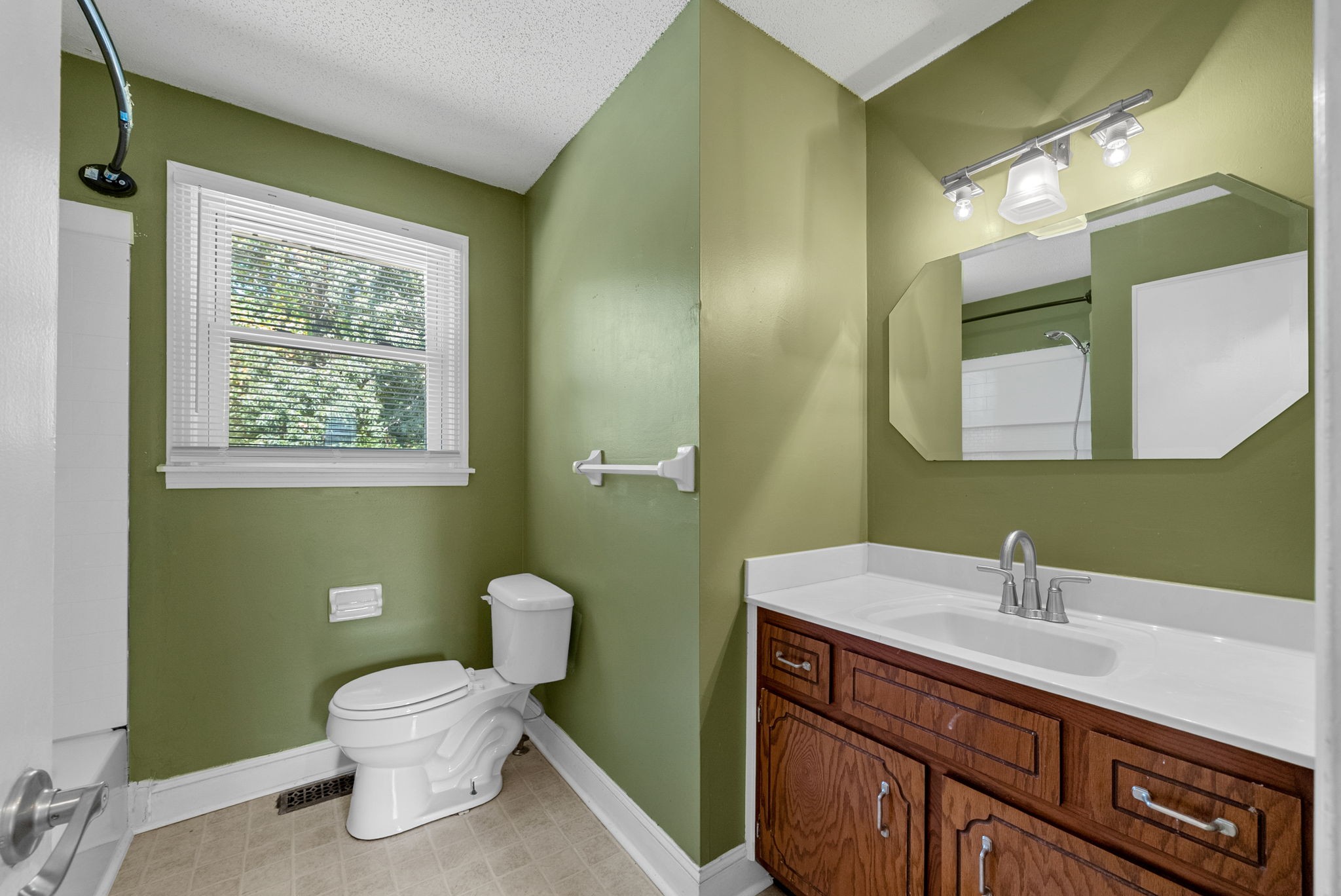 809 Pollard Road Clarksville, TN 37042 - Photo 21 of 28 a bathroom with a toilet sink and mirror