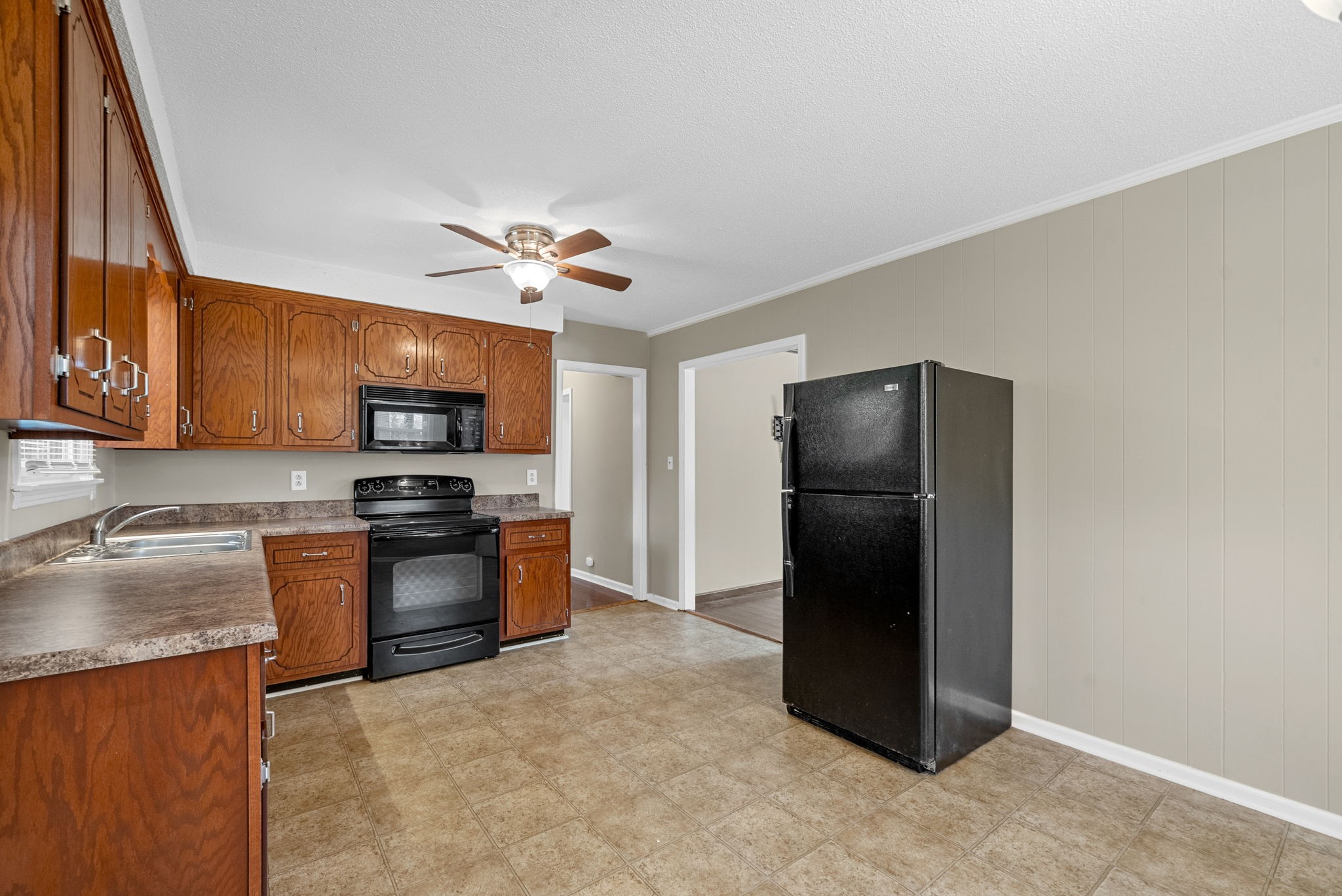 809 Pollard Road Clarksville, TN 37042 - Photo 10 of 28 a kitchen with stainless steel appliances granite countertop a refrigerator a stove top oven a sink and dishwasher