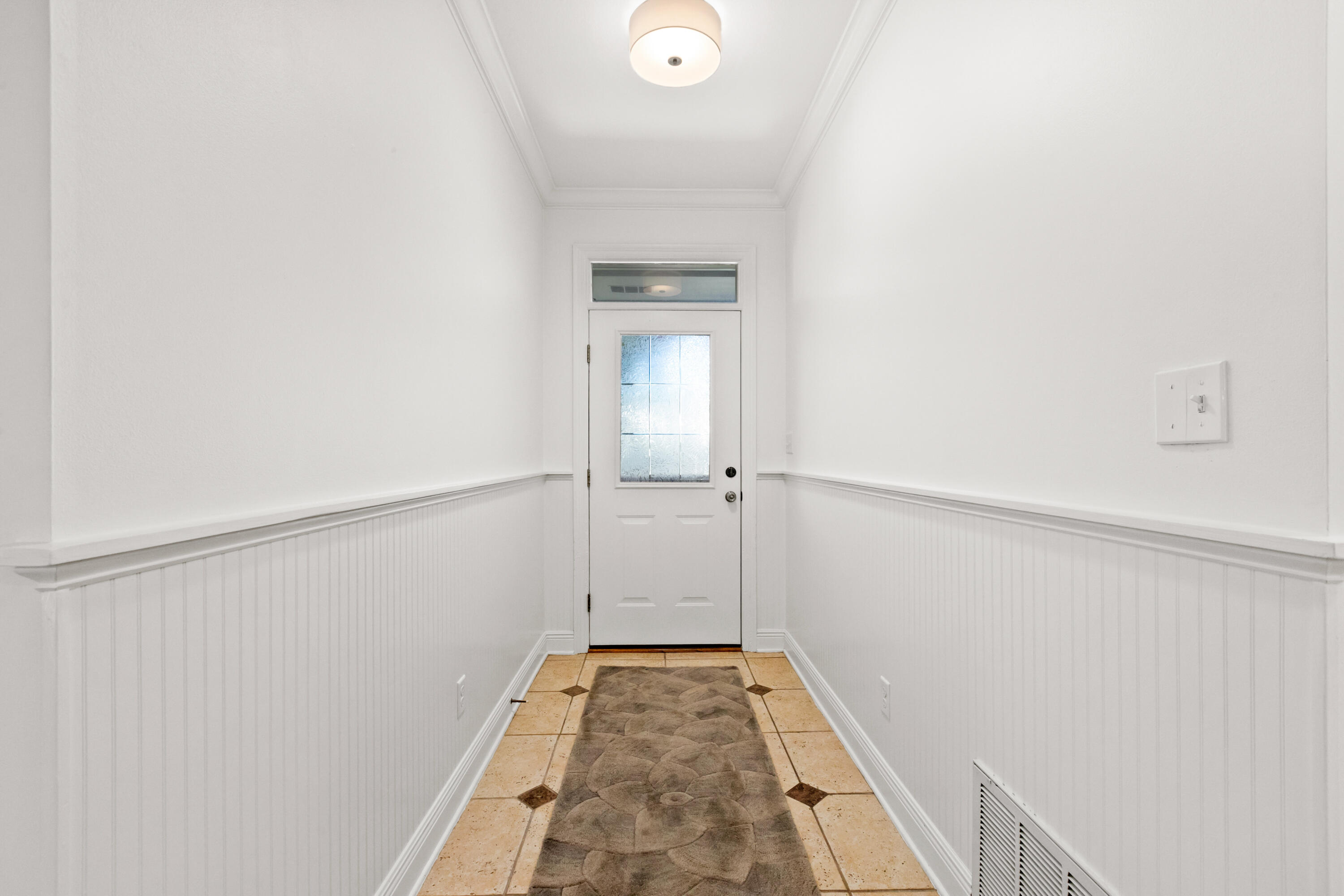 128 Beth Lane Santa Rosa Beach, FL 32459 - Photo 8 of 47 a view of a hallway with wooden floor and staircase