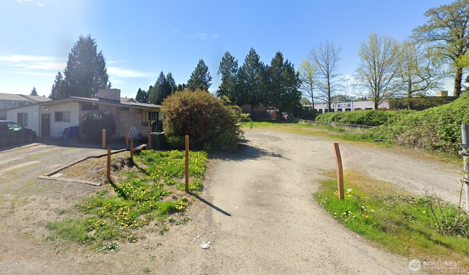 a view of a street in front of a house