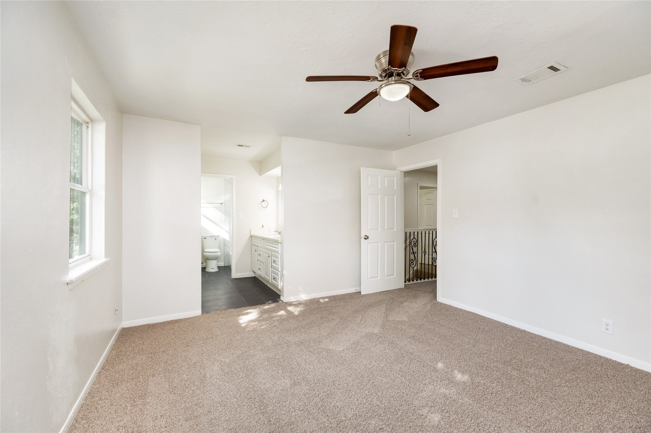 24118 Spring Mill Lane Spring, TX 77373 - Photo 16 of 24 a view of an empty room with a ceiling fan