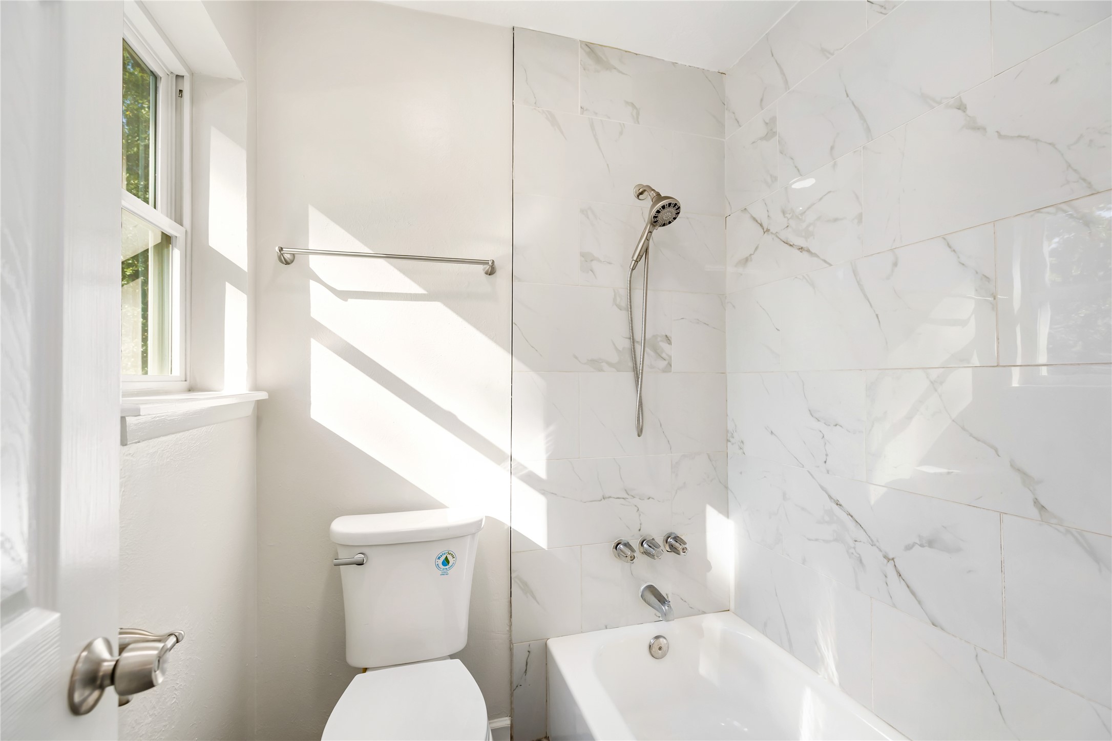 24118 Spring Mill Lane Spring, TX 77373 - Photo 18 of 24 a bathroom with a sink a toilet and shower