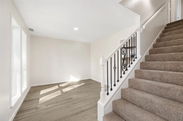 a view of entryway with wooden floor