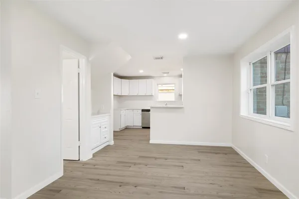 a view of kitchen and wooden floor